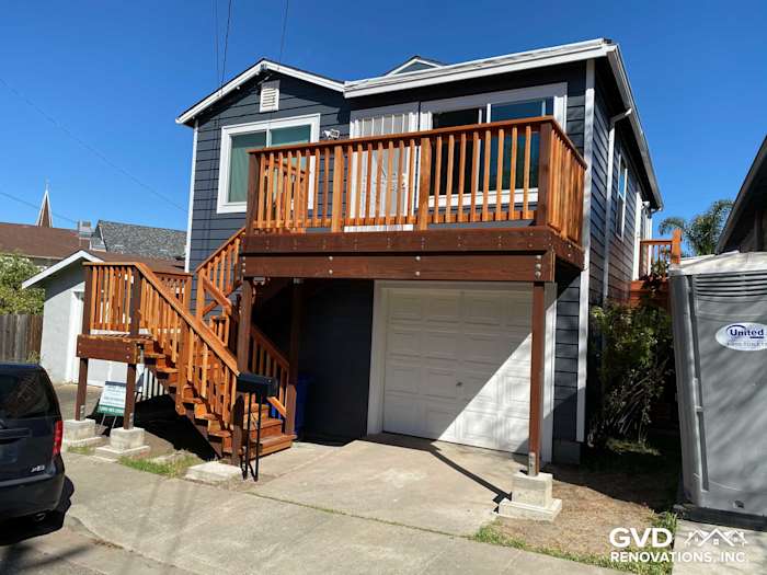 Updated home exterior in Rio Vista featuring CraneBoard vinyl siding, new decking, and Anlin windows