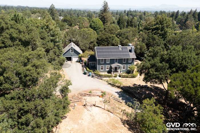 Home exterior featuring newly installed James Hardie Evening Blue siding with Arctic White trim in Sebastopol, CA