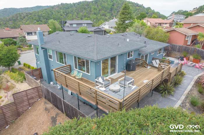 Home exterior featuring Evening Blue James Hardie siding, Anlin Catalina windows, and a spacious wood deck in San Rafael