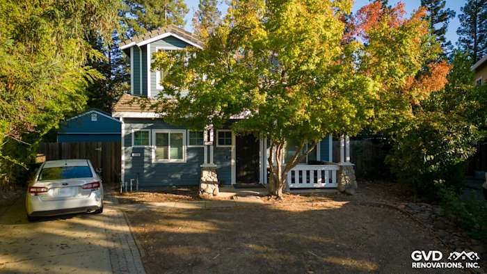 New Alside Prodigy vinyl siding on a two-story home with a welcoming porch and colorful foliage in Folsom