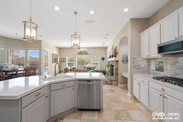 Bright kitchen with white cabinetry, stainless steel appliances, and a spacious island in Sacramento remodel