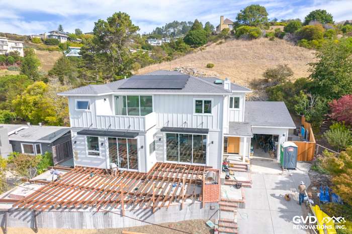 Modern home exterior featuring installed James Hardie Artisan Lap Siding, large windows, and open deck area in Tiburon