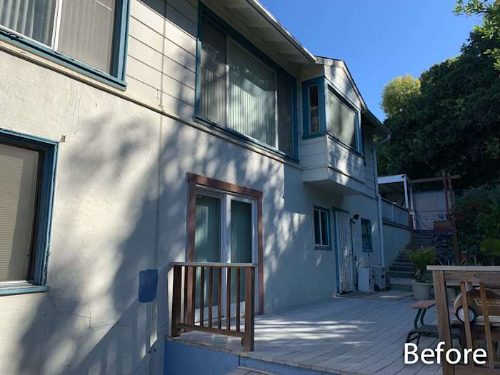 Home exterior in Oakland, CA, featuring outdated siding and old windows before renovation