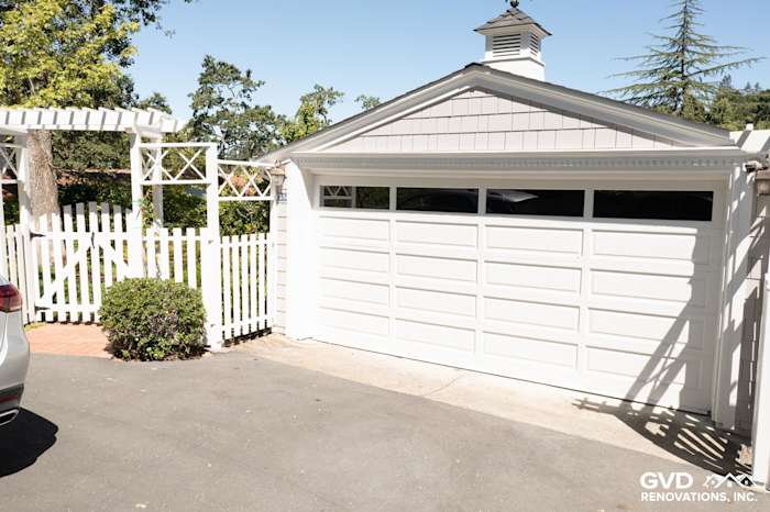 White garage door with James Hardie shingle siding in Pearl Gray and white trim in Orinda, CA