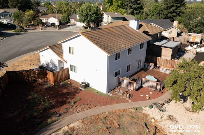 New white siding and energy-efficient windows enhance this Petaluma home's curb appeal and modern aesthetic