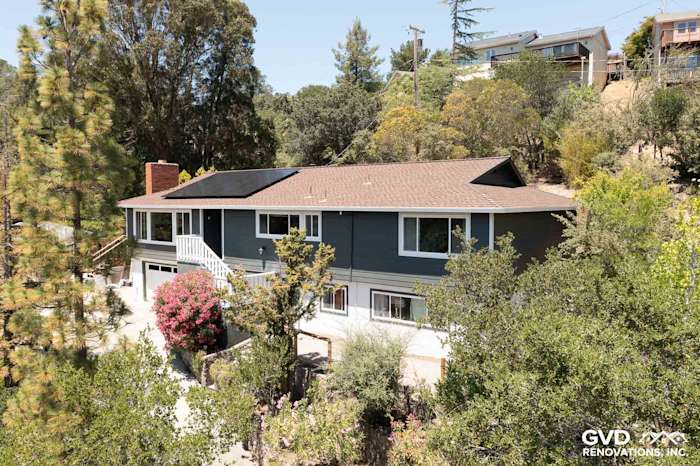 Home exterior featuring James Hardie Iron Gray siding, Arctic White trim, and a landscaped front yard in San Rafael