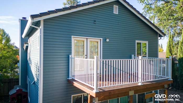 New Alside Prodigy vinyl siding in muted blue with a deck and white railings in Folsom, CA