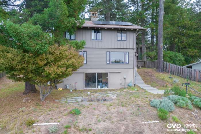Home exterior featuring James Hardie Lap and Batten Board Siding in Timber Bark color and Anlin Windows in Berkeley
