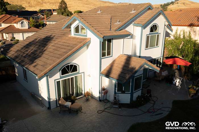 Charming home exterior with Arctic White James Hardie siding and Simonton windows in Hercules, CA