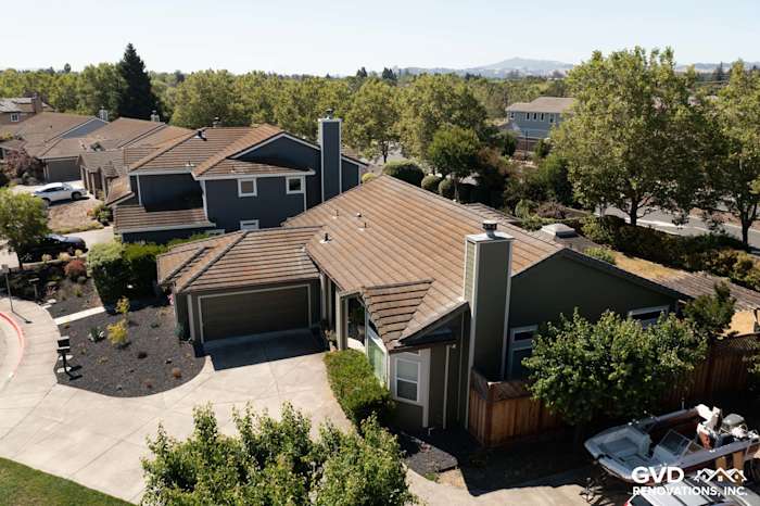 Petaluma home featuring Mountain Sage James Hardie siding and Cobble Stone trim in a landscaped setting