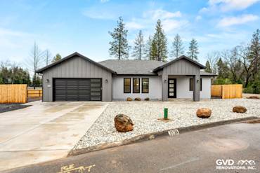 New construction home in Paradise featuring James Hardie Architectural Panels in Sea Grass and black Milgard windows