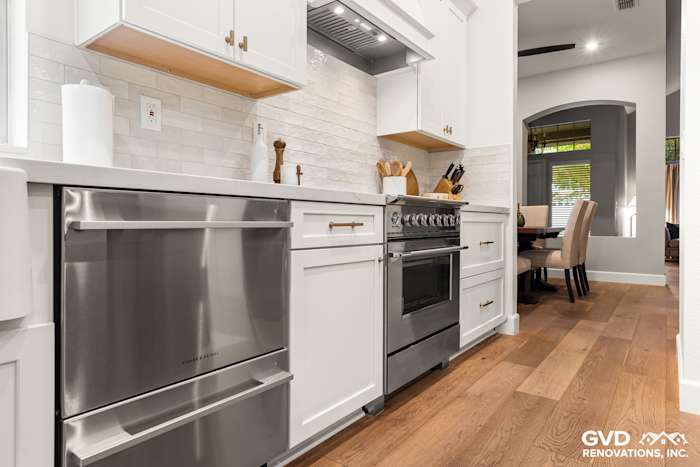 Modern kitchen with Waypoint cabinets, Custom Vadara Bronzo countertops, and stainless steel appliances in Folsom, CA
