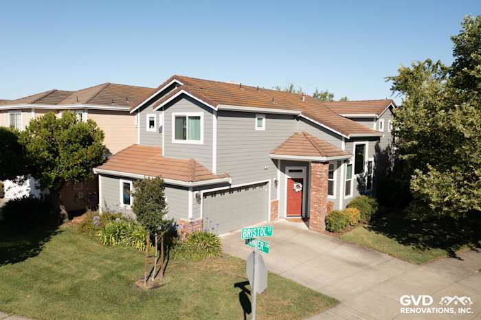 Home exterior featuring Gray Slate James Hardie siding, Milgard windows, and brick accents in Petaluma, CA