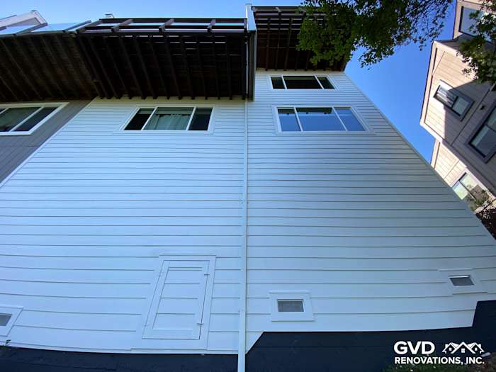 Freshly installed pre-finished James Hardie lap siding on home exterior in Mill Valley, showcasing a clean, modern look