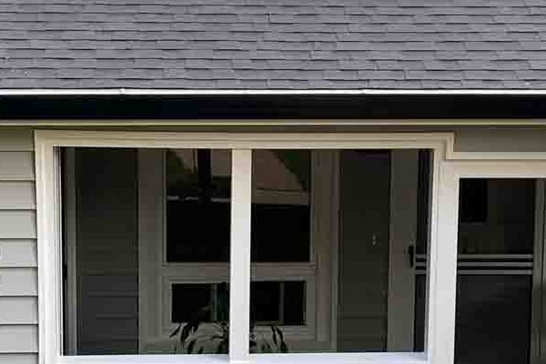 Stylish home exterior in Grass Valley featuring light gray Prodigy Vinyl Siding and a landscaped entryway