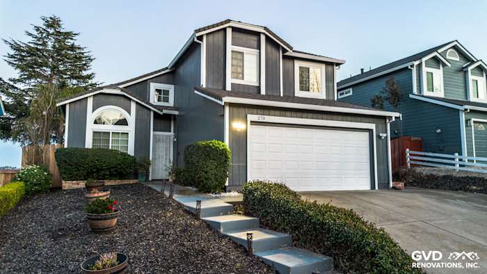 Modern home exterior in Vallejo featuring James Hardie Evening Blue siding and Arctic White trim with landscaped garden