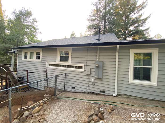 Gray Prodigy Vinyl Siding on a residential home in Grass Valley, showcasing new windows and a modern exterior