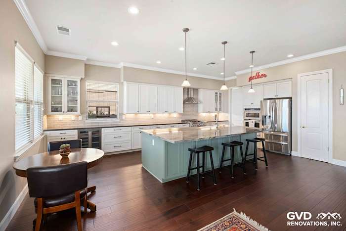 Modern kitchen renovation in El Dorado Hills featuring white cabinetry, quartz island, hardwood flooring, and stainless