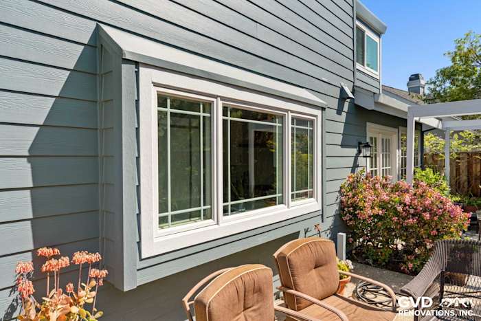 Boothbay Blue HardiePlank siding and Arctic White trim with Milgard windows in Foster City backyard setting