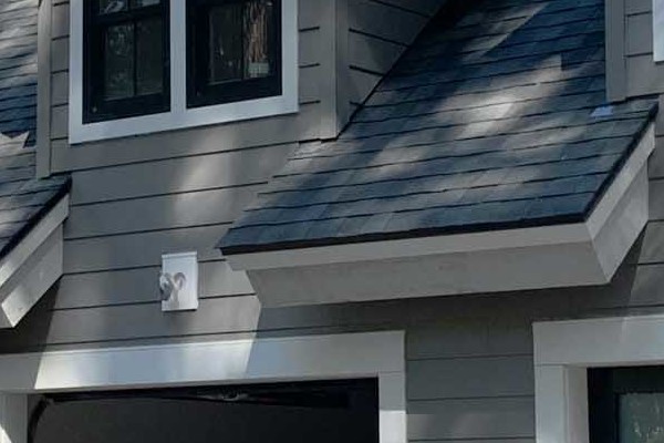Newly installed James Hardie siding with trim on a Tahoe City home, showcasing a modern gray color and stylish gables