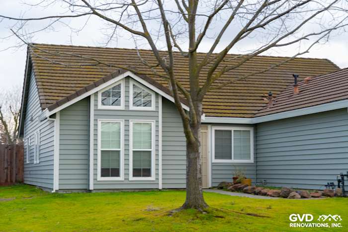 Home exterior featuring Prodigy Solid Core Insulated Siding, painted eaves, and a lush green lawn