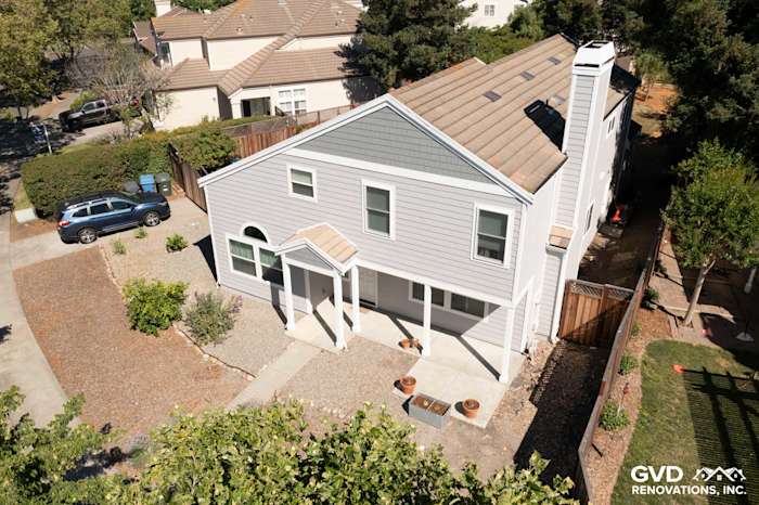 Two-story home in Petaluma featuring Pearl Gray James Hardie siding, Arctic White trim, and new vinyl windows