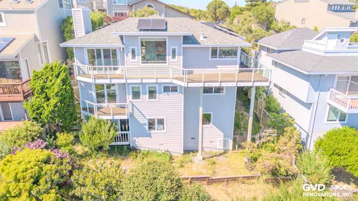 Mill Valley home featuring James Hardie Pearl Gray siding, Arctic White trim, and spacious deck area
