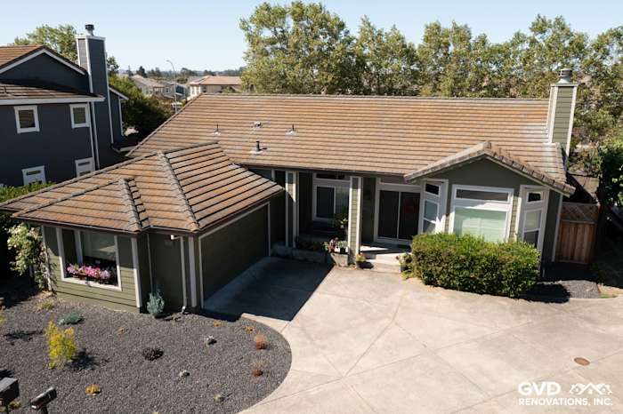 Petaluma home featuring Mountain Sage James Hardie siding and Cobble Stone trim with landscaped driveway