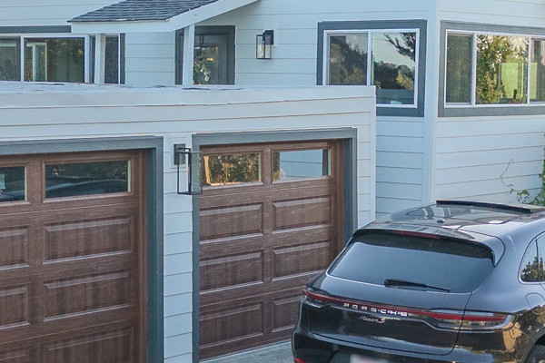 Modern home exterior in Orinda featuring James Hardie Color Lap Plank Siding in Arctic White and Anlin Windows