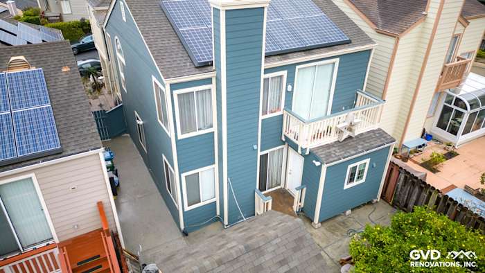 Two-story home in Daly City with Evening Blue HardiePlank siding and solar panels on the roof