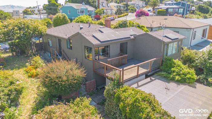 Home exterior featuring James Hardie Shake and Shingle Siding in brown with a deck and surrounding greenery in Vallejo, CA