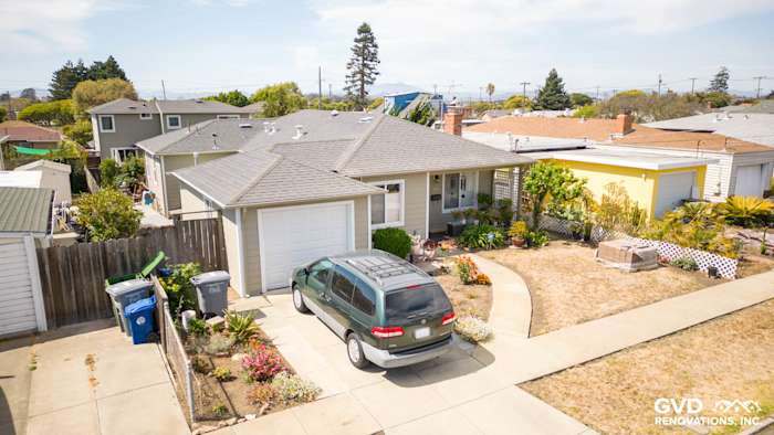 El Cerrito home featuring James Hardie Monterey Taupe siding and Arctic White trim, with driveway and landscaped yard