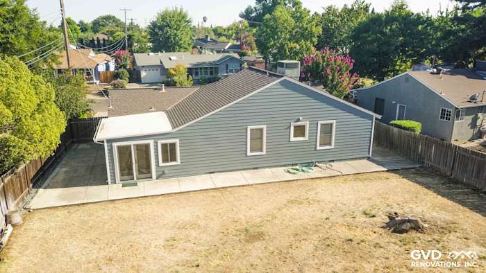 James Hardie Boothbay Blue siding on Sacramento home exterior with Arctic White trim and spacious backyard