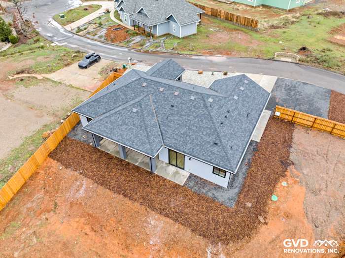 New construction home in Paradise, CA featuring James Hardie siding and Milgard black windows