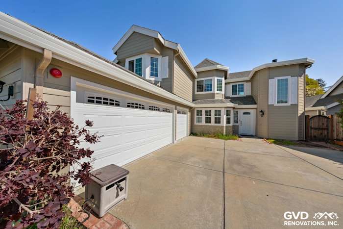 Monterey Taupe James Hardie lap siding and Arctic White trim on a Foster City home exterior, featuring Alside Mezzo windows