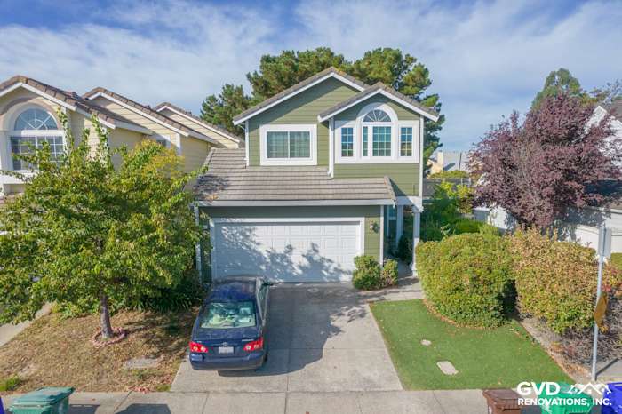 Home exterior featuring Mountain Sage James Hardie siding, Arctic White trim, and landscaped front yard in Pinole, CA
