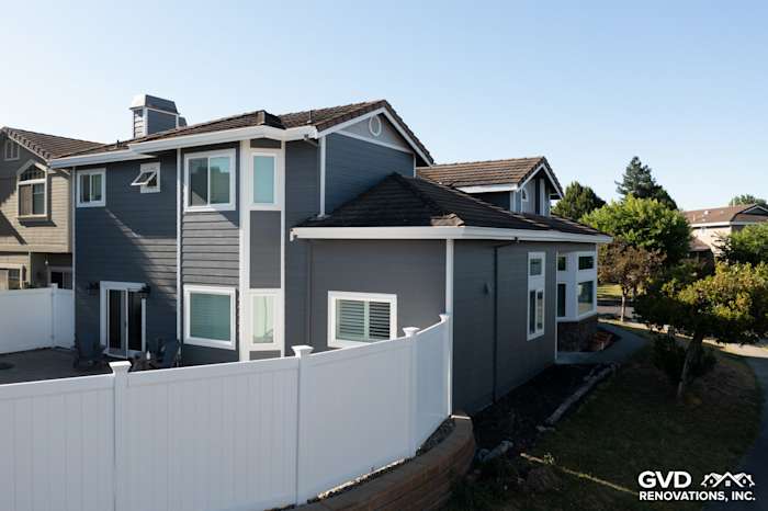 Home exterior showcasing James Hardie Night Gray lap siding, Pearl Gray shingle siding, and vinyl windows in Petaluma