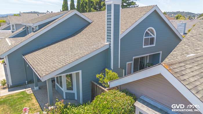 Foster City home featuring Boothbay Blue James Hardie siding with Arctic White trim and a modern gable roof