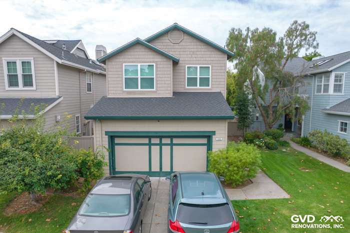 Revitalized home exterior in San Rafael featuring Anlin Catalina Windows and repaired siding, showcasing modern design