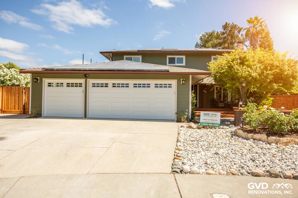 Exterior of home in Pleasanton with new James Hardie siding, updated garage doors, and landscaped driveway