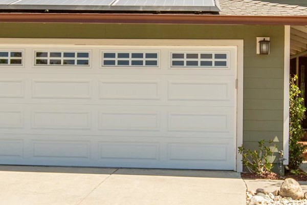 Exterior of home in Pleasanton with new James Hardie siding, updated garage doors, and landscaped driveway