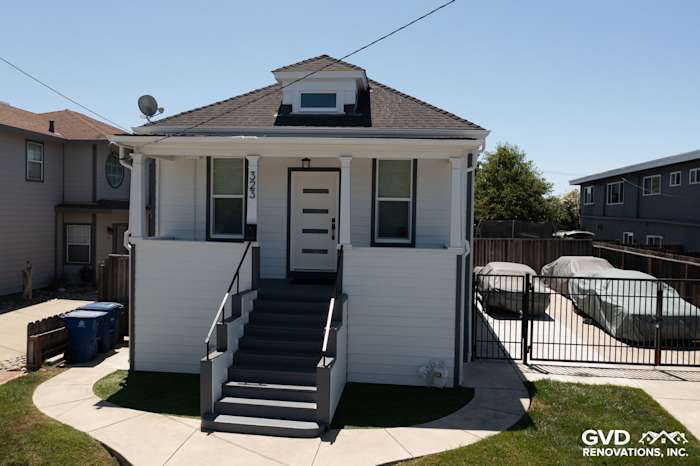 Modern San Leandro home featuring James Hardie Arctic White siding and trim, with a stylish entryway and landscaping