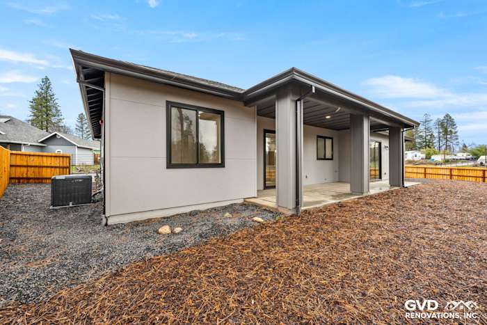 New construction home exterior in Paradise featuring James Hardie Architectural Panels and Milgard black windows
