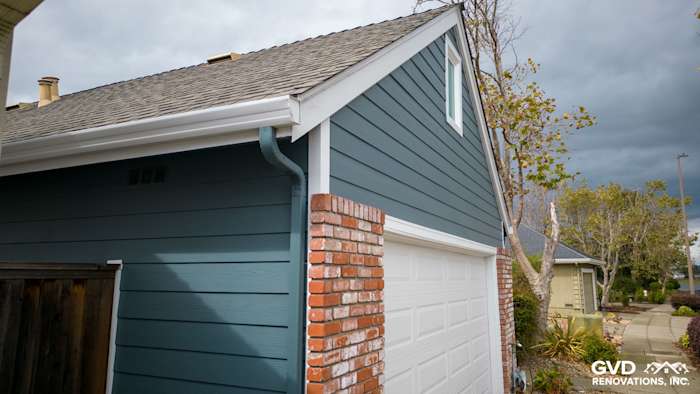 Evening Blue HardiePlank siding and Arctic White trim on Alameda home exterior with brick accents