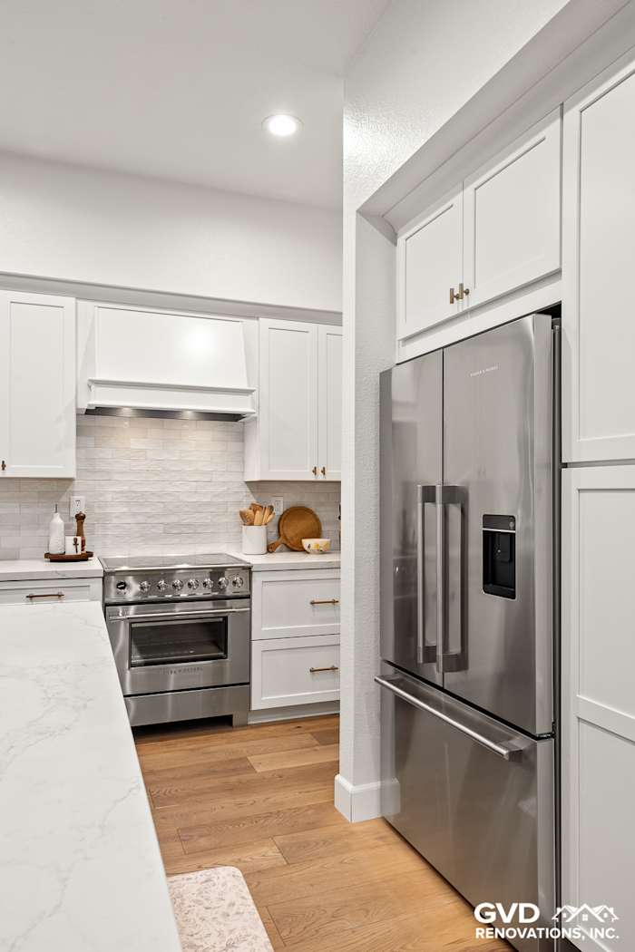 Modern kitchen featuring Waypoint cabinets, Custom Vadara Bronzo countertops, and stainless steel appliances in Folsom, CA