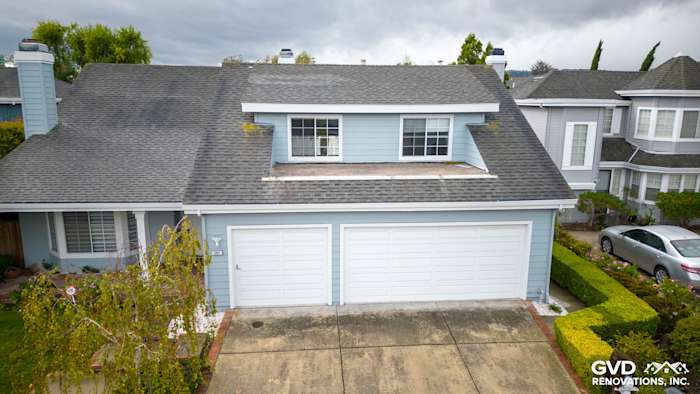 Foster City home with James Hardie Cedarmill Siding, HardieTrim, and a renovated garage facade
