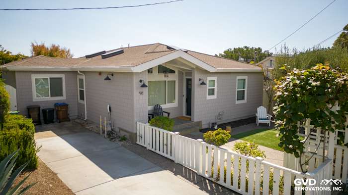 Mill Valley home featuring Pearl Gray James Hardie shingle siding and Arctic White trim. Landscaped front yard with white