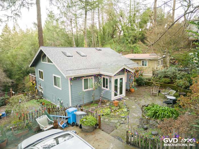 Modern home exterior featuring Boothbay Blue James Hardie siding and white trim in Forestville, CA