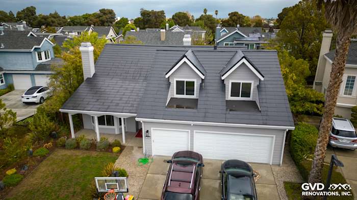 New Pearl Gray James Hardie plank lap siding and Arctic White trim on home exterior in Foster City