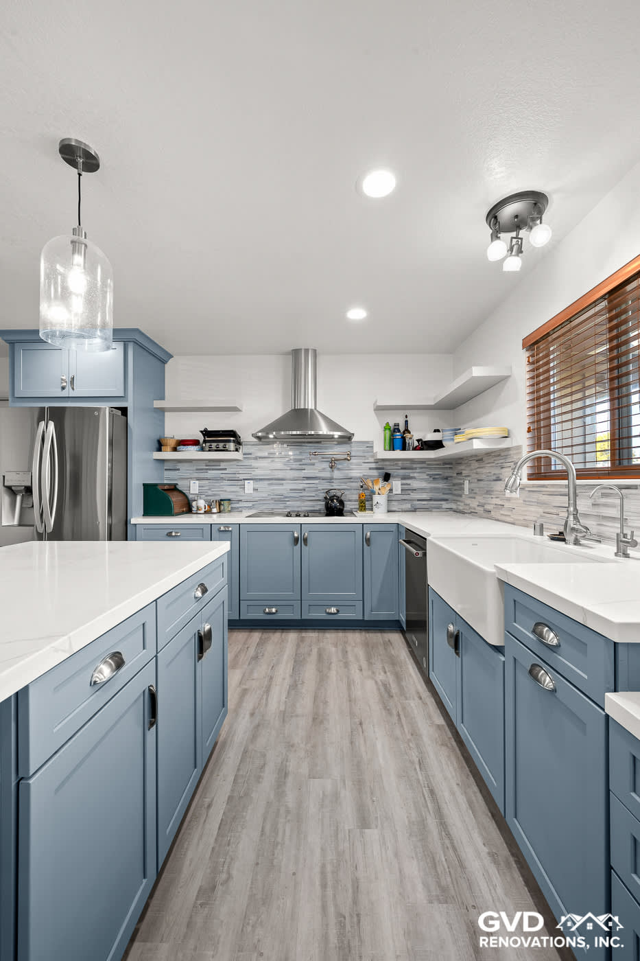 Bright, modern kitchen with blue cabinets and quartz countertops in Sacramento